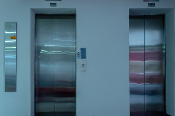 a isolated front view shoot of two elevators with metal doors