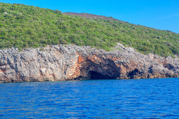 rocky coast with cave in Adriatic Sea