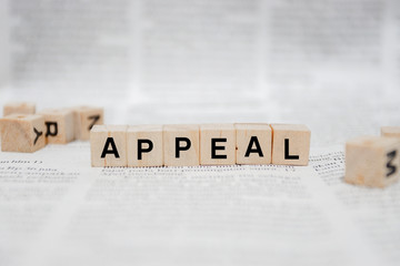 Appeal Word Written In Wooden Cube - Newspaper