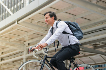 Businessman cycling to work