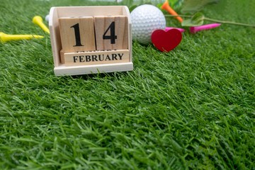 Golf on Valentine's day with 14th February on green grass