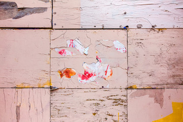 Texture of old burned peeling paint on a wall