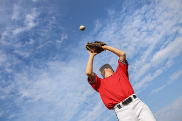 Boy catching a baseball