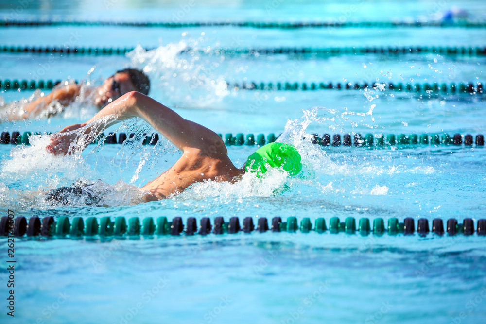 Wall mural swimmers in a freestyle race