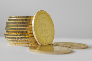 Golden bitcoin on white table and background - business concept of crypto currency.