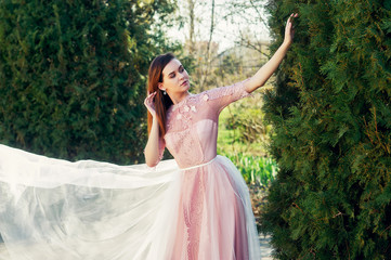 Young romantic girl in a dress