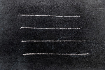 White chalk hand drawing in line shape on black board background