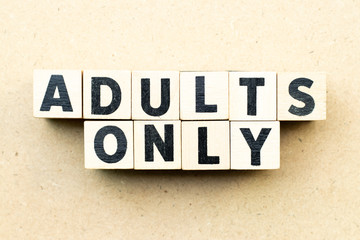 Letter block in word adults only on wood background