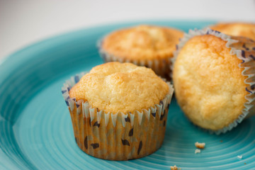 Homemade muffins on a blue plate.