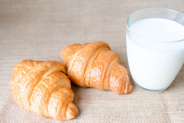 Croissants and milk on table.  Food for breakfast concept