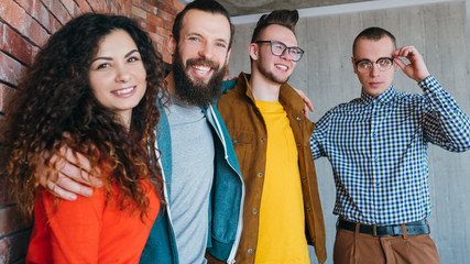 Equality, diversity and inclusion. Friendly and tolerant millennials. Hipsters getting on well with geek guy. Successful teamwork.