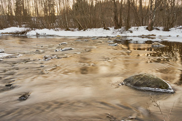 Flooding river in spring afternoon