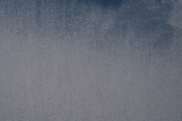 Texture blue metal sheet background painted with paint with strips of natural dirt from the movement 