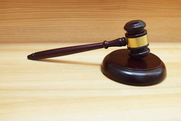 Judges gavel or law mallet and sound block on wooden background with copy space. Judgement or auction, justice and legal law system concept.