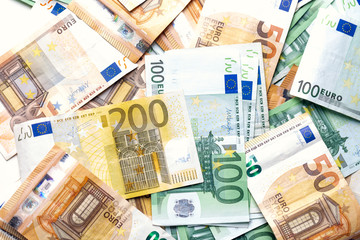 Euro banknotes from above. Scattered banknotes on the table.