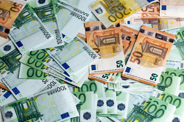 Euro banknotes from above. Scattered banknotes on the table.