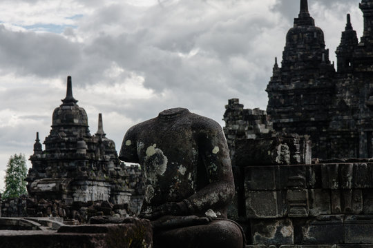 A headless Buddha statue at Sewu Temple (Candi Sewu), Yogyakarta, Indonesia