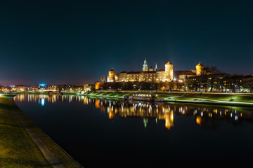 Fototapeta na wymiar Wawel hill with royal castle at night. Krakow is one of the most famous landmark in Poland