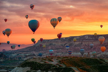 Hot Air balloons flying tour over Mountains landscape spring sunrice Cappadocia, Goreme Open Air...