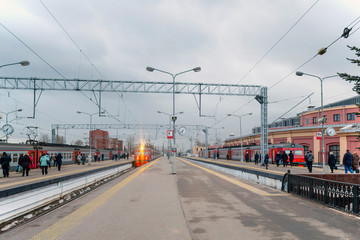 The bustle of the modern metropolis. People rush to board the train.The platform of the railway...