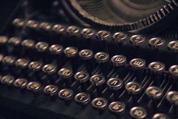 Vintage antique collectible typewriters close-up. Russian keyboards.