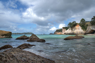 Fototapeta na wymiar Rock formations and islands off the beach at Cathedral Cove