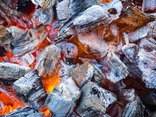 Photo of hot sparking live-coals burning in a barbecue