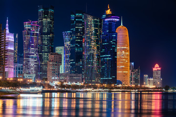 Fototapeta na wymiar Doha Qatar skyline cityscape with skyscrapers at night