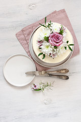 Fresh flowers decorated white cake