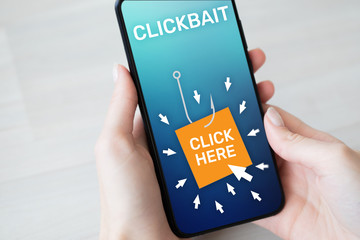 Clickbait, advertising, spam icons on mobile phone screen. Internet and business concept.