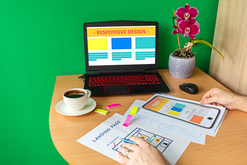 Man designing landing page website optimized for mobile and SEO