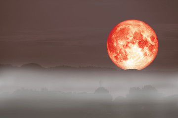 Naklejka na ściany i meble full red fish moon back on cloud and fog on mountain night sky