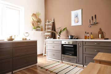Fototapeta na wymiar Modern interior of kitchen with stylish furniture