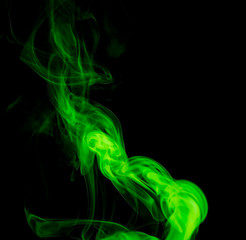 Fototapeta premium Green smoke on black background