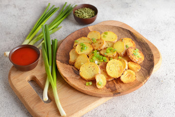 Fototapeta na wymiar Plate with tasty baked potato and onion on grey table