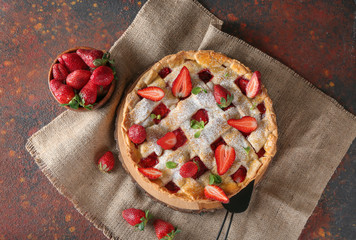 Tasty strawberry pie on color background