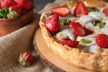 Tasty strawberry pie on table, closeup