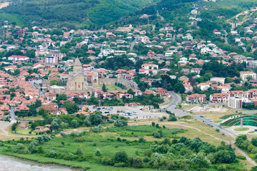 Obraz premium Mtskheta, Georgia - Jul 07 2018: Holy city of Mtskheta view from Jvari Monastery in Mtskheta, Mtskheta-Mtianeti, Georgia. It is part of the World Heritage Site - Historical Monuments of Mtskheta.