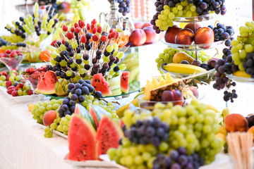 Delicious fruits bar with bananas, grapes, strawberry and other fruits