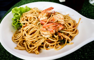 Close up of Spaghetti with spicy prawn on white dish