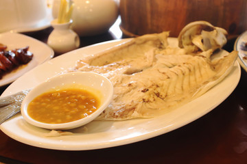 Closeup of Steamed Fish chinese style on white dish