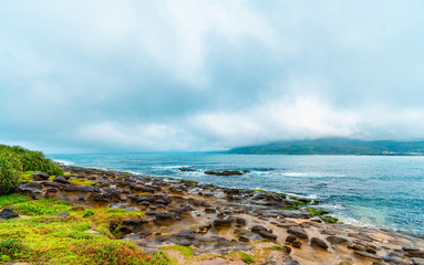 Beautiful seaside stone under the gloomy sky background. holiday concept. BEIJING, CHINA
