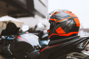 closeup helmet on bigbike with soft-focus and over light in the background