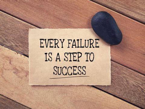 Motivational and inspirational quote - Every Failure Is A Step To Success written on a paper.
