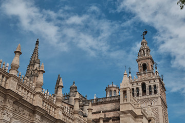 Fototapeta premium Cathedral of Saint Mary of the See (Seville Cathedral) in Seville, Andalusia, Spain in a sunny and cloudy day.