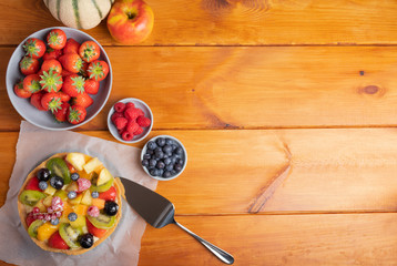 homemade fruit pie on a rustic wooden table top view