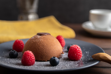 french mouse cake with raspberries and blue berries