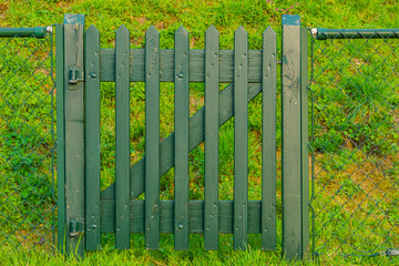 green wooden gate, entry to the garden or paddock