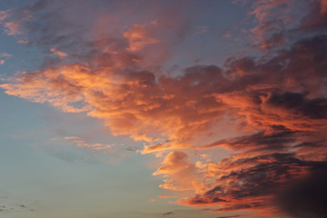 Beautiful blue sky with clouds of various shapes and colors.