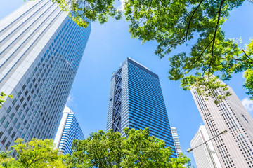 looking up view of city skyline in tokyo, japan